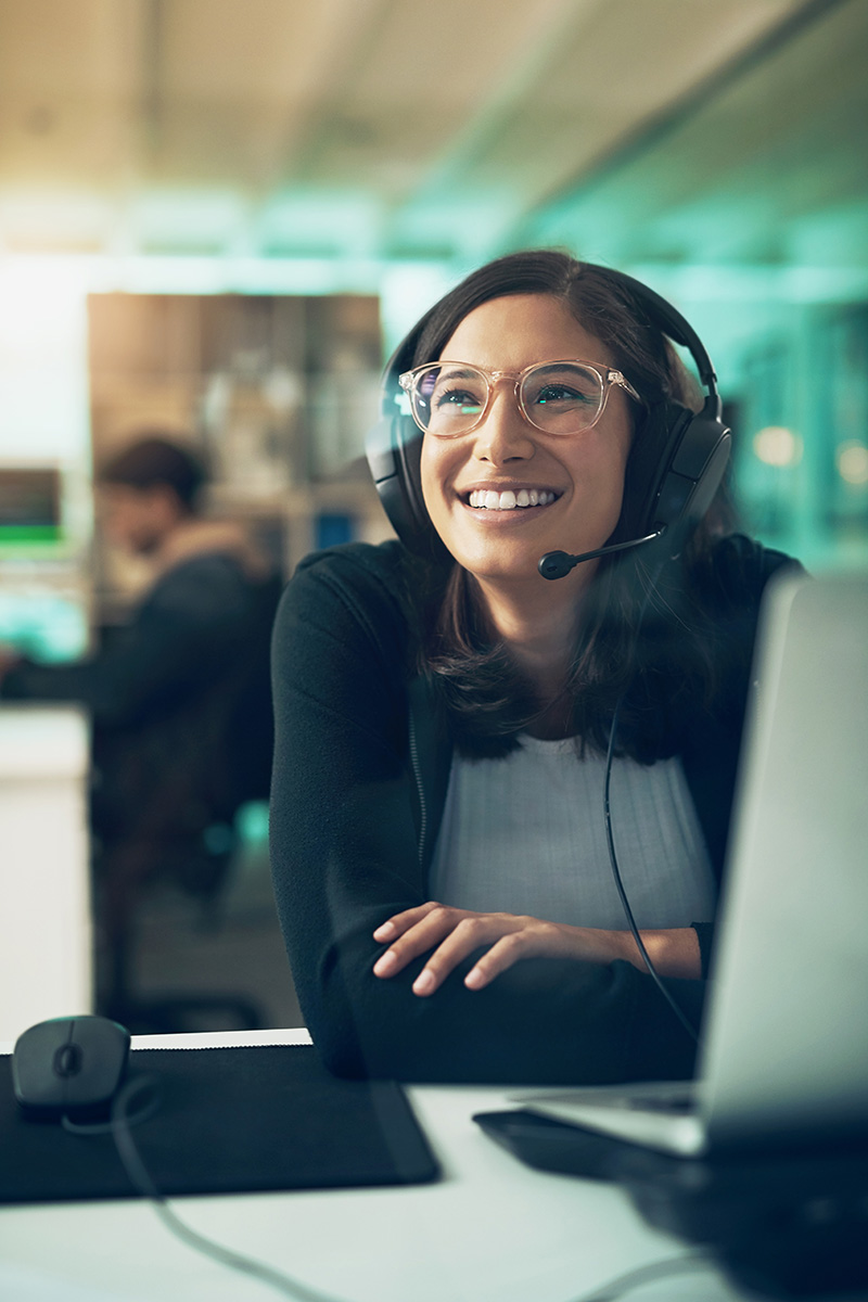 an Integrated Tax Services expert speaking to a client over the phone while sitting at their desk